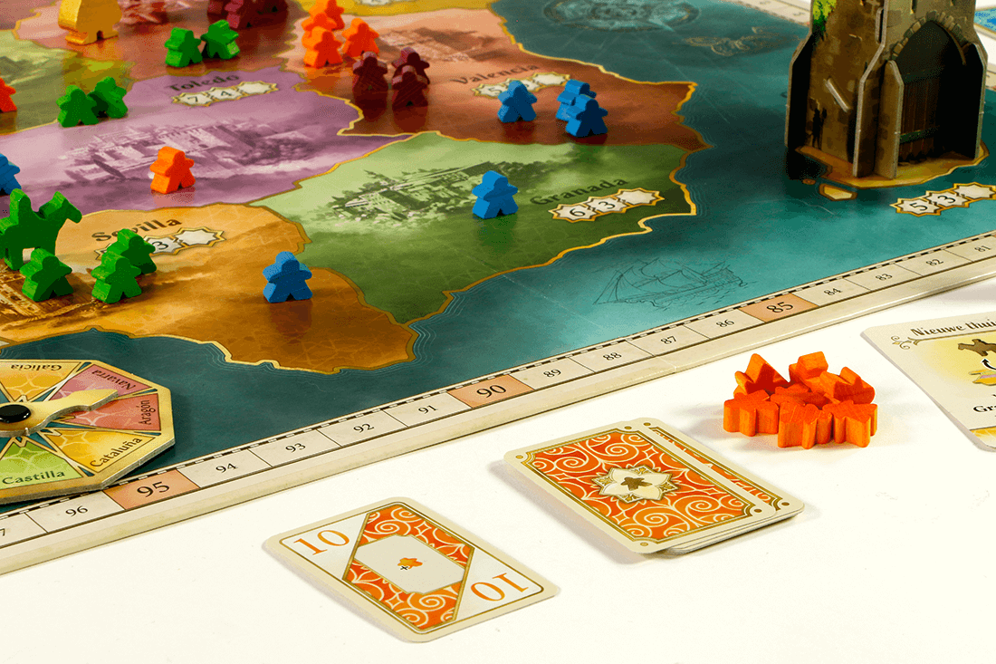 Close-up of El Grande board game showing colorful player pieces and tactical cards on the game board.
