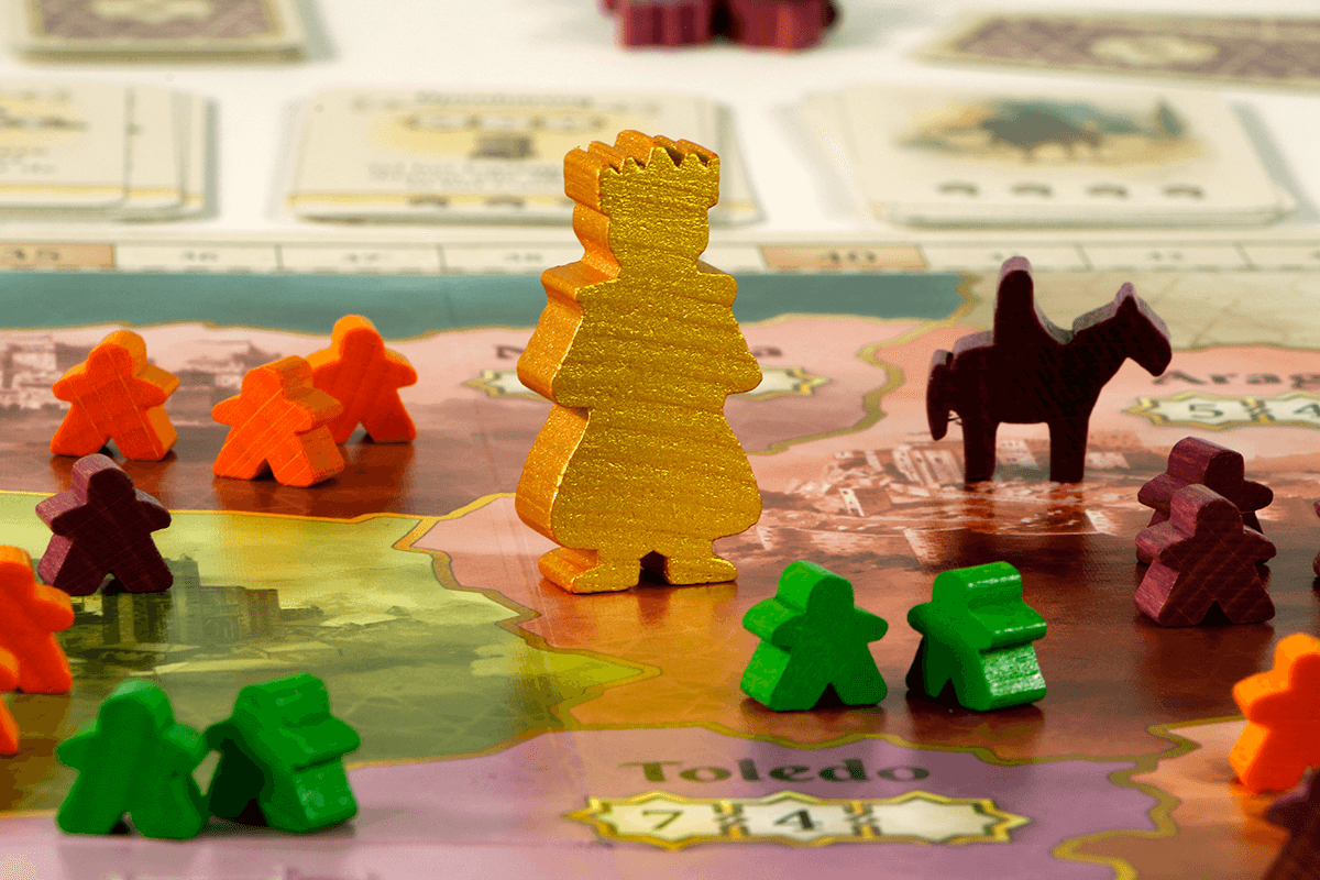 El Grande board game with colorful caballeros pieces positioned on a detailed game map.