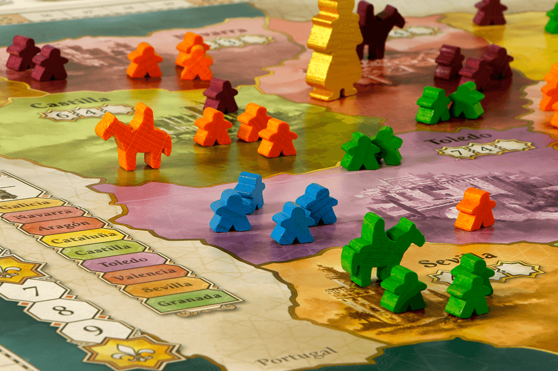 Colorful game pieces on a map for El Grande, a strategic area control board game set in medieval Spain.