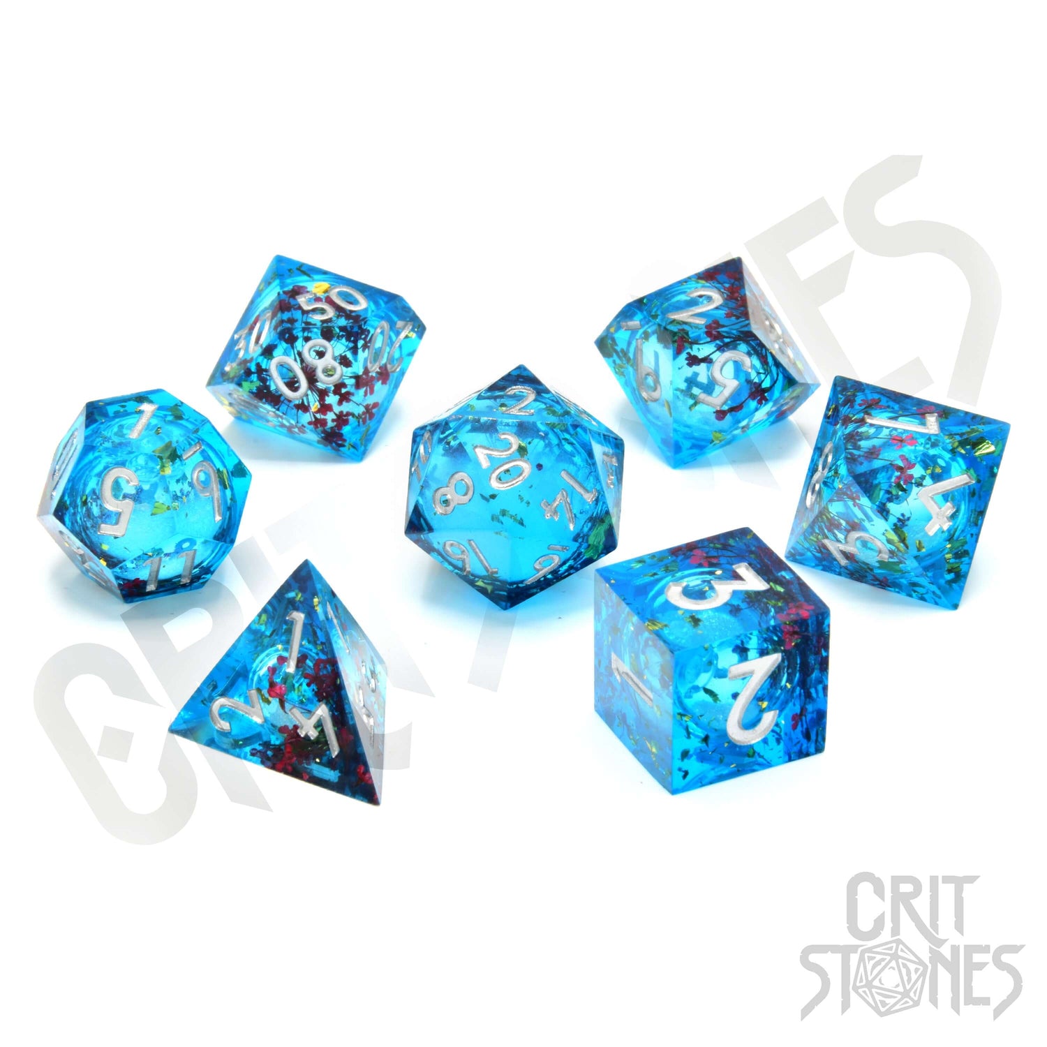 Vibrant blue resin RPG dice set featuring gold flakes and red flowers with a shimmering liquid core.