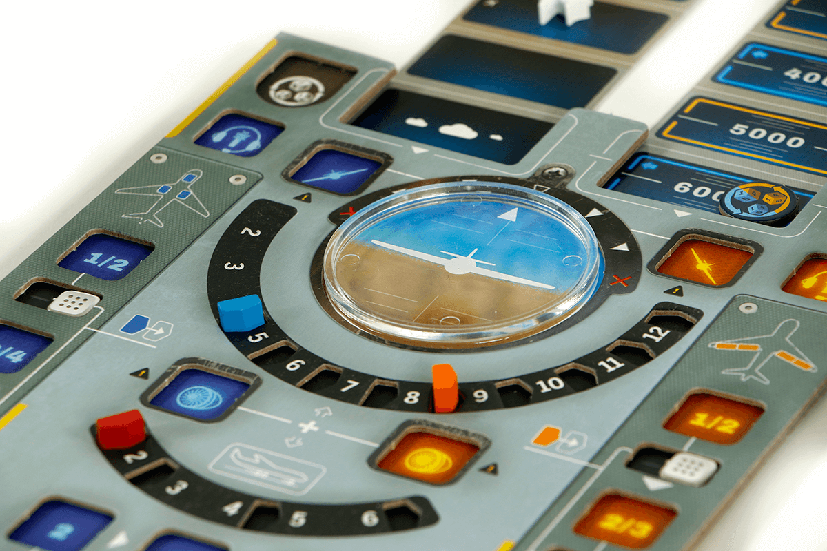 Close-up of Sky Team board game showing cockpit controls and dice for collaboration in landing a plane.