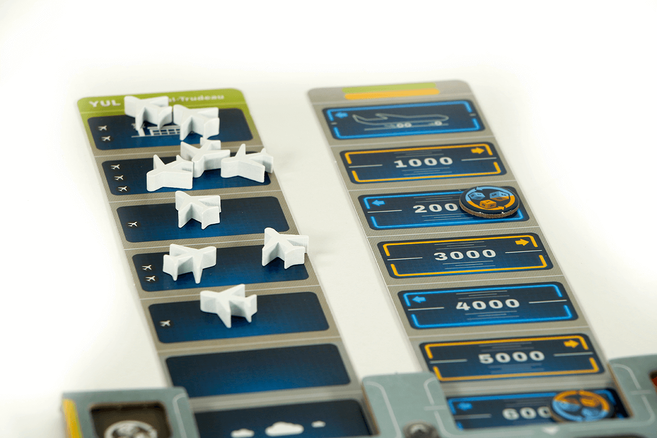 Sky Team cooperative dice game components with airplane tokens and score tracker.
