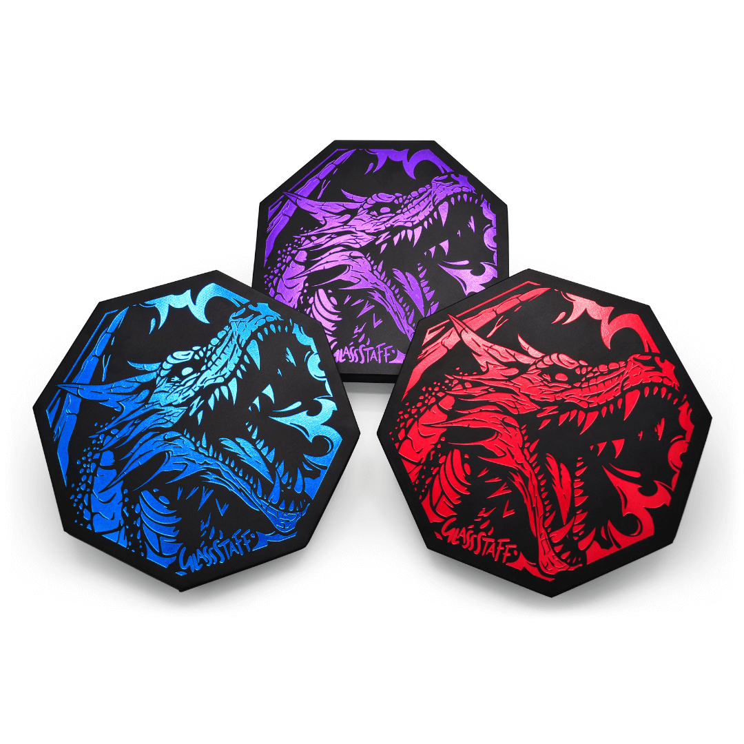 Set of three GlassStaff Dragon-themed dice trays in blue, purple, and red with intricate artwork for gaming enthusiasts.